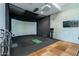 Golf simulator room with projector and various clubs at 7180 E Kierland Blvd # 1115, Scottsdale, AZ 85254