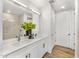 Double vanity bathroom with modern white cabinets at 3131 N Central Ave # 6012, Phoenix, AZ 85012