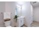 Simple bathroom with single vanity, toilet, and small plant at 3131 N Central Ave # 5021, Phoenix, AZ 85012