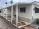 Mobile home with covered patio and steps at 7300 N 51St Ave # 208, Glendale, AZ 85301