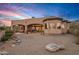 Home's backyard features a covered patio and gravel landscaping at 11519 E Blue Wash Rd, Cave Creek, AZ 85331