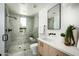 Modern bathroom with a walk-in shower, gray tile, and floating vanity at 6554 N 40Th Pl, Paradise Valley, AZ 85253
