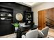 Modern home office features built-in shelving and a large desk, ideal for work or study at 6554 N 40Th Pl, Paradise Valley, AZ 85253