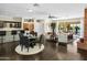 Open dining area with a seating area and hardwood floors at 7120 N Clearwater Pkwy, Paradise Valley, AZ 85253
