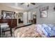 Bedroom with bed, dresser and access to other rooms at 2 E Muriel Dr, Phoenix, AZ 85022