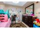 bedroom with desk, dresser and toys at 2 E Muriel Dr, Phoenix, AZ 85022