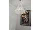 Elegant crystal chandelier and vintage art print at 8094 E Via Del Vencino --, Scottsdale, AZ 85258