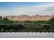 Stunning aerial view showcasing the property's expansive backyard and breathtaking mountain backdrop at 6112 E Quartz Mountain Rd, Paradise Valley, AZ 85253