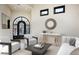 Elegant entryway with arched iron door and seating area at 6112 E Quartz Mountain Rd, Paradise Valley, AZ 85253
