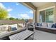 Covered patio with comfortable seating and outdoor grill at 21088 E Arroyo Verde Dr, Queen Creek, AZ 85142