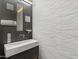 Modern powder room with marble sink and unique wallcovering at 4796 E Charles Dr, Paradise Valley, AZ 85253