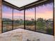 Bonus room featuring expansive windows and sunset views at 4796 E Charles Dr, Paradise Valley, AZ 85253