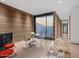 Modern game room with concrete floors, large window, and stylish seating at 4796 E Charles Dr, Paradise Valley, AZ 85253