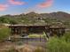 Stunning aerial view of modern home with infinity pool at 4796 E Charles Dr, Paradise Valley, AZ 85253