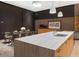 Spacious kitchen with large island, modern cabinetry, and glass dining table at 4796 E Charles Dr, Paradise Valley, AZ 85253