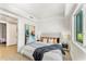 Bright bedroom with a king-size bed and large window at 3131 N Central Ave # 3015, Phoenix, AZ 85012