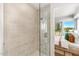 Walk-in shower with neutral tile and glass enclosure at 3131 N Central Ave # 3015, Phoenix, AZ 85012