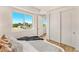 Bright bedroom with a queen-size bed and city views at 3131 N Central Ave # 3015, Phoenix, AZ 85012