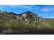 Modern home with stone accents and desert landscaping at 9108 E Grapevine Pass --, Scottsdale, AZ 85262