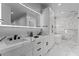 Modern bathroom with dual vanity, quartz countertops and large mirror at 628 W El Pajarito Dr, Wickenburg, AZ 85390