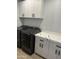Laundry room with modern cabinets and appliances at 628 W El Pajarito Dr, Wickenburg, AZ 85390