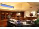 Home library with built-in bookshelves and comfortable seating at 15 Biltmore Estates Dr, Phoenix, AZ 85016