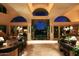 Open living area with floor-to-ceiling windows and pool view at 15 Biltmore Estates Dr, Phoenix, AZ 85016
