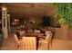Spacious outdoor kitchen with a built-in grill and bar seating at 15 Biltmore Estates Dr, Phoenix, AZ 85016