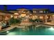Expansive backyard oasis with a sparkling pool and shade structure at 15 Biltmore Estates Dr, Phoenix, AZ 85016
