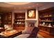 Cozy sitting area with fireplace and built-in shelves at 15 Biltmore Estates Dr, Phoenix, AZ 85016