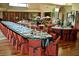 Formal dining room with a long table set for a large dinner party at 15 Biltmore Estates Dr, Phoenix, AZ 85016