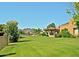 Landscaped backyard with grassy lawn and gazebo at 15 Biltmore Estates Dr, Phoenix, AZ 85016