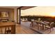 Living room with access to a large balcony featuring sunset views at 4849 N Camelback Ridge Rd # B208, Scottsdale, AZ 85251