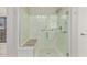 Walk-in shower with built-in seat and grab bars at 42833 W Mallard Rd, Maricopa, AZ 85138