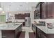 Modern kitchen with stainless steel appliances, granite countertops, and an island at 42833 W Mallard Rd, Maricopa, AZ 85138