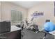 Home gym with elliptical, weights, and exercise ball at 42833 W Mallard Rd, Maricopa, AZ 85138