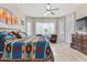 Main bedroom with king bed, ceiling fan, and southwest decor at 42833 W Mallard Rd, Maricopa, AZ 85138