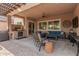 Covered patio with seating area, built-in grill, and outdoor kitchen at 42833 W Mallard Rd, Maricopa, AZ 85138