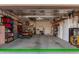 Two-car garage with golf cart and ample storage at 42833 W Mallard Rd, Maricopa, AZ 85138