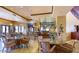 Community room with tables, chairs, and a serving bar at 42833 W Mallard Rd, Maricopa, AZ 85138
