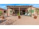 Large covered patio with seating and dining areas at 42833 W Mallard Rd, Maricopa, AZ 85138