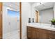 Clean bathroom with wood vanity and glass shower at 38152 N 109Th St, Scottsdale, AZ 85262