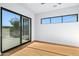Bedroom with sliding glass doors to patio and wood floors at 38152 N 109Th St, Scottsdale, AZ 85262