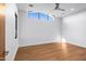 Light and airy bedroom with wood floors and large window at 38152 N 109Th St, Scottsdale, AZ 85262