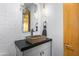 Contemporary bathroom with a sleek concrete sink and geometric tile at 38152 N 109Th St, Scottsdale, AZ 85262