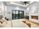 Bright main bedroom featuring a fireplace and backyard view at 38152 N 109Th St, Scottsdale, AZ 85262