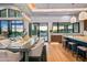 Spacious dining area with large windows and modern light fixtures at 38152 N 109Th St, Scottsdale, AZ 85262