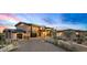 Modern home with a dramatic entryway and landscaped grounds at 38152 N 109Th St, Scottsdale, AZ 85262