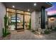 Modern entryway with glass doors and desert landscaping at 38152 N 109Th St, Scottsdale, AZ 85262