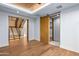 Modern hallway with wood floors and barn door at 38152 N 109Th St, Scottsdale, AZ 85262